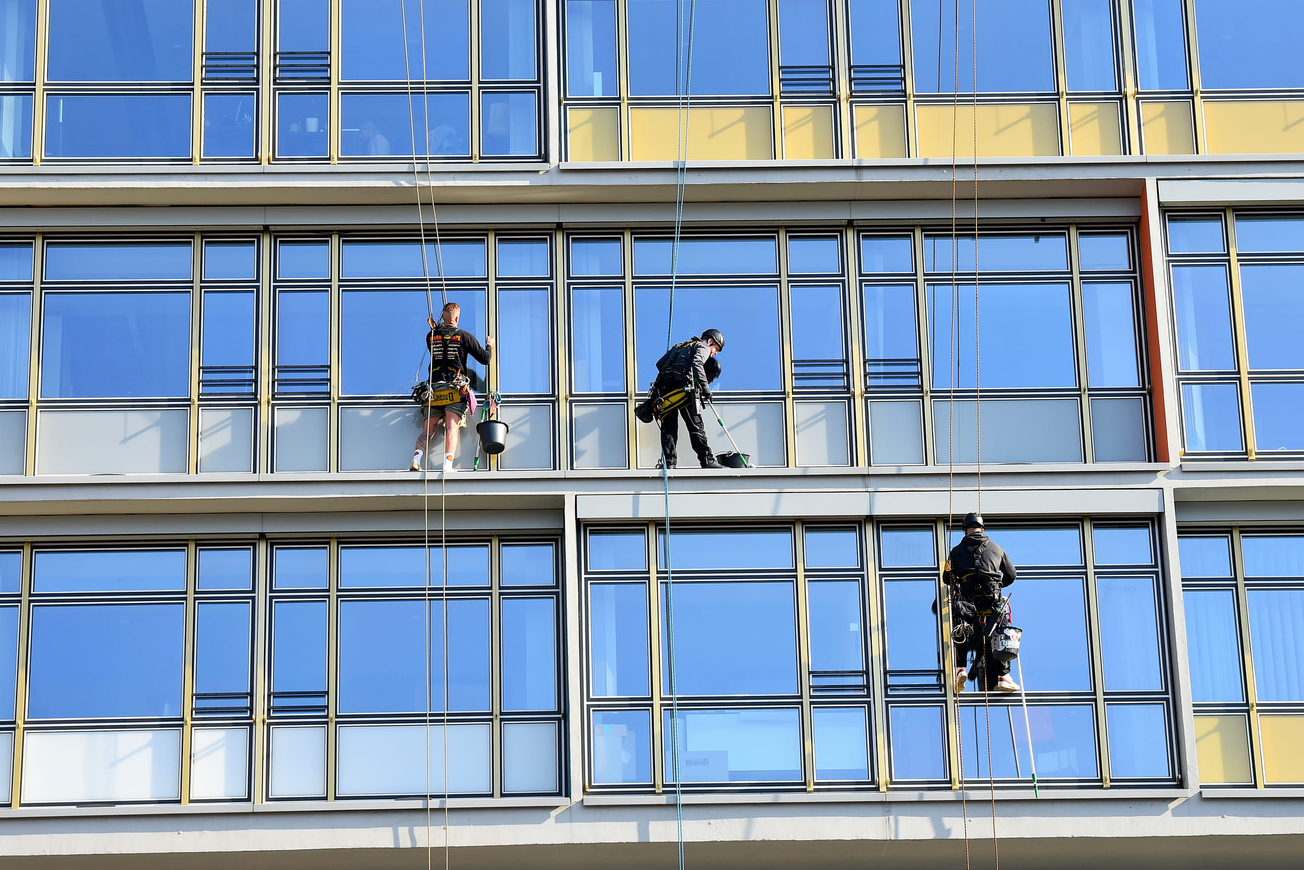 low-angle-view-men-working-modern-building
